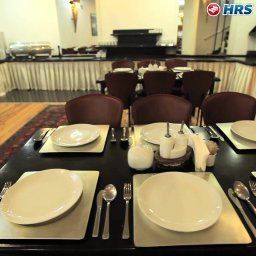Salle du petit-déjeuner située dans le restaurant Residence Hotel Fotos
