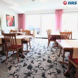 Sala de desayuno en el restaurante Ihr Hotel Garni Fotos