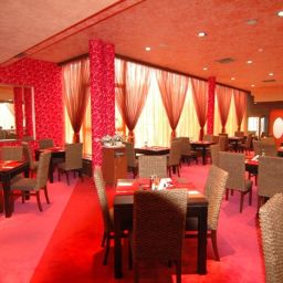 Salle du petit-déjeuner située dans le restaurant Leipzig Hotel Fotos