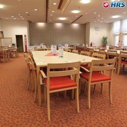 Salle du petit-déjeuner située dans le restaurant Commundo Tagungshotel Fotos