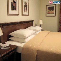 Номер Ramada Plaza City Centre Hotel & Suites Fotos