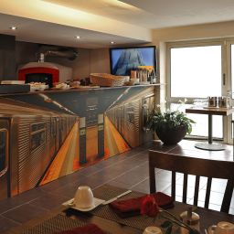 Salle du petit-déjeuner située dans le restaurant Heckenrose Fotos