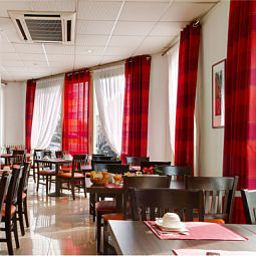 Salle du petit-déjeuner située dans le restaurant Lausanne Nice Centre Fotos