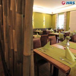 Sala de desayuno en el restaurante Akazienhof Land Gast Haus Fotos