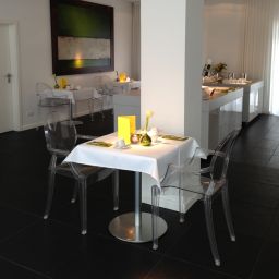 Sala colazione nel ristorante Q! Casa Fotos