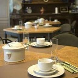 Salle du petit-déjeuner située dans le restaurant Bellx Fotos