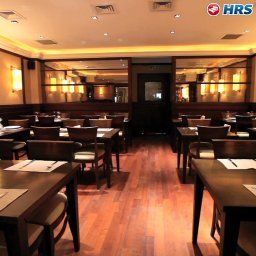 Salle du petit-déjeuner située dans le restaurant Pera Rose Fotos