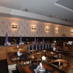 Breakfast room within restaurant Mythos Fotos