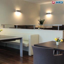 Salle du petit-déjeuner située dans le restaurant Artus Apartments Fotos
