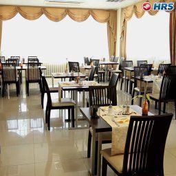 Salle du petit-déjeuner située dans le restaurant Jfm Hotel Fotos
