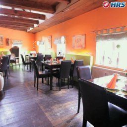 Salle du petit-déjeuner située dans le restaurant Altes Zollhaus Fotos