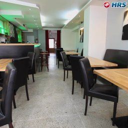 Salle du petit-déjeuner située dans le restaurant Bene Residence Fotos