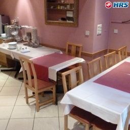 Breakfast room within restaurant Albergo Fotos