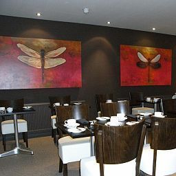 Salle du petit-déjeuner située dans le restaurant Mode Fotos