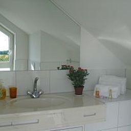 Camera da bagno Apart Hotel Scheuer Fotos