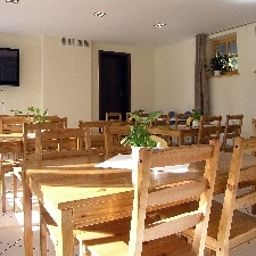 Salle du petit-déjeuner située dans le restaurant Bellamonte Aparthotel Fotos
