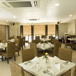 Salle du petit-déjeuner située dans le restaurant IRIS Fotos