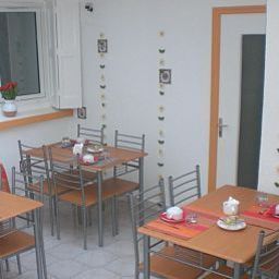 Salle du petit-déjeuner Le Centre Fotos