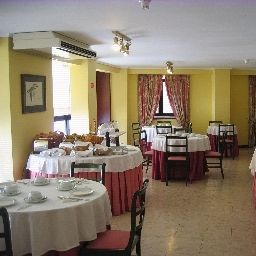 Salle du petit-déjeuner située dans le restaurant Da Bolsa Fotos