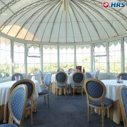 Salle du petit-déjeuner située dans le restaurant Villa Maria Fotos