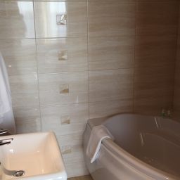 Camera da bagno mHotel Fotos