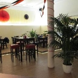 Salle du petit-déjeuner située dans le restaurant Tom Tom's Sporthotel und Restaurant Fotos