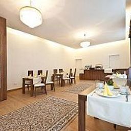 Sala de desayuno en el restaurante Apart Suites Fotos