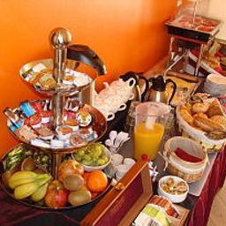 Salle du petit-déjeuner située dans le restaurant Pension de Watertoren Fotos