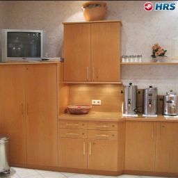 Salle du petit-déjeuner située dans le restaurant Pension Fünfhaus Fotos