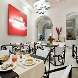 Sala de desayuno en el restaurante Coppe Fotos