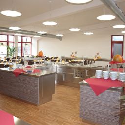 Sala de desayuno en el restaurante afz Campus Fotos