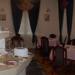 Salle du petit-déjeuner située dans le restaurant Grinka M Hotel Fotos