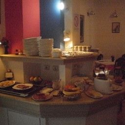 Salle du petit-déjeuner située dans le restaurant Grinka M Hotel Fotos
