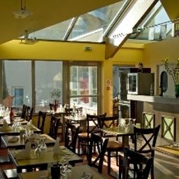 Salle du petit-déjeuner située dans le restaurant Bienvenue Hotel Citotel Fotos