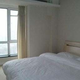 Camera Huayang Nianhua Hotel - Dalian Fotos