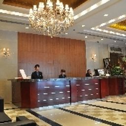 Réception New East Asia Hotel Fotos